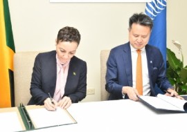 Minister of Foreign Affairs and Foreign Trade, Kamina Johnson Smith (left), and Director General of the World Intellectual Property Organization (WIPO), Daren Tang, sign copies of a letter of intent for training on intellectual property (IP)
