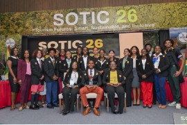 Carnival Corporation’s Philcher Grant and Marie McKenzie, at left, join Regional Tourism Youth Congress 2026 participants and CTO officials Thursday at SOTIC 2026 in Georgetown, Guyana. Seated in front, from left, are second-place finisher Raia Cargill of The Bahamas, winner Amarni Webster of Anguilla and third-place finisher Jahneil McKenzie of Barbados.