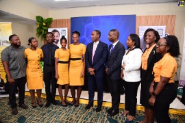 Minister of Finance and the Public Service, Dr. the Hon. Nigel Clarke (sixth left), with some student-teachers at the launch of the $2.5-billion Science, Technology, Engineering and Mathematics (STEM) education scholarships, held today (June 29), at the Courtyard by Marriott Hotel in New Kingston. Also pictured with the student-teachers are President of The Mico University College, Dr. Asburn Pinnock (seventh left), and Executive Director of the Students’ Loan Bureau (SLB), Nickeisha Walsh (third right). (Photo courtesy of Adrian Walker via JIS)