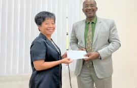 Taiwan Ambassador to St. Luccia Nicole Su, presents a US$200,000 cheque to Crispin d’Auvergne, Climate Change and Disaster Risk Management Coordinator with the OECS Commission, for the EC Solar Challenge, which will benefiOECS countries