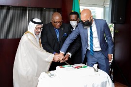 Prime Minister Dr. Timothy Harris, cutting the ceremonial cake with the Minister of State, H.E. Khalifa Shaheen Almarar. (SKNIS photo)