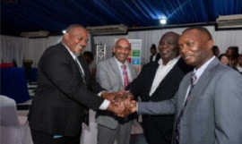 A show of unity in the fight against illicit supply of weapons as demonstrated by: (from left) Richard Troupe, Director, Safety and Security in Schools in the Ministry of Education, Skills, Youth & Information; UNDP Resident Representative, Dr Kishan Khoday; United Nations Resident Coordinator, Dennis Zulu; and Delroy Simpson, Chief Technical Director, Security Risk Reform and Transformation Policy Division in the Ministry of National Security.