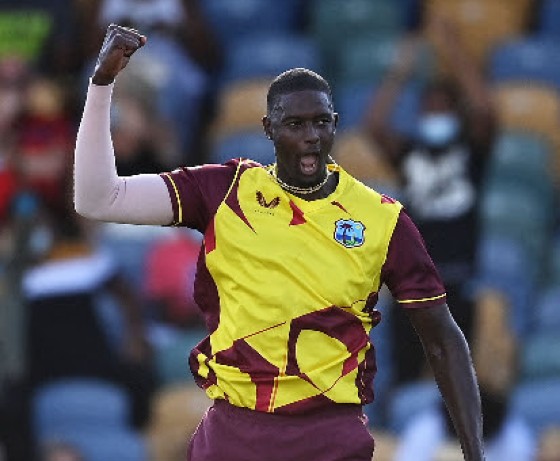 Fast bowler Jason Holder celebrates one of his four wickets against England on Saturday.
