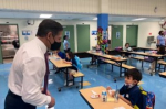 MDCPS Alberto Carvalho speaking with students in a socially distanced lunchroom. Courtesy: Miami Dade County Public Schools Facebook.