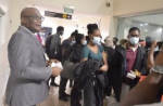 Minister of State in the Ministry of Foreign Affairs and Foreign Trade Leslie Campbell speaking to Jamaican students on their arrival at the Sangster International Airport in Montego Bay from Ukraine on Wednesday.